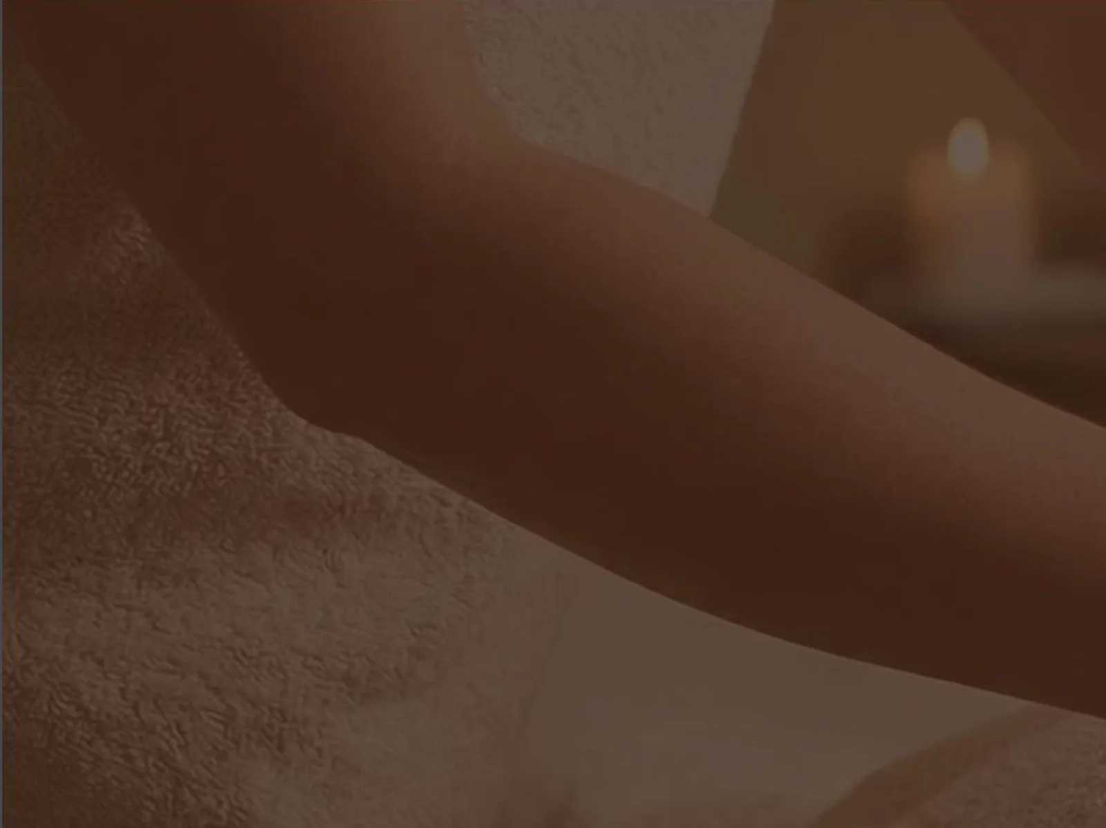 Spa massage treatment with soft candlelight